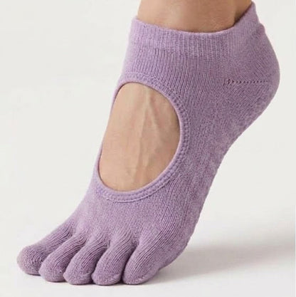Lavender ARCHE five-toe grip socks worn on foot with a minimalist open-top design for Pilates, yoga, barre and studio workouts.