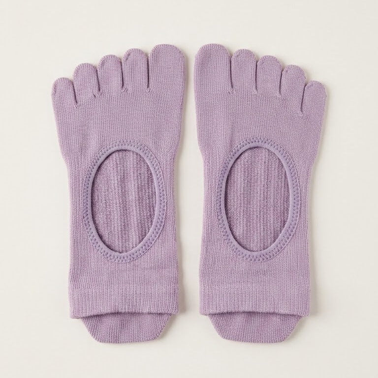 Lavender ARCHE five-toe grip socks with a minimalist open-top design for Pilates, yoga, barre and studio workouts.