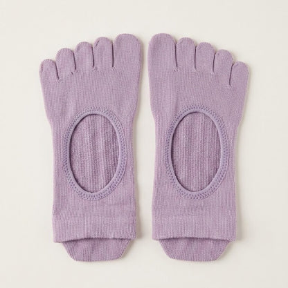 Lavender ARCHE five-toe grip socks with a minimalist open-top design for Pilates, yoga, barre and studio workouts.